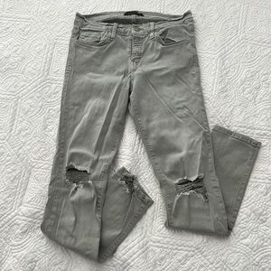 Green-grey flying monkey distressed jeans
